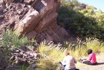 Students contemplating in the field