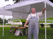 Farmer with Tent at Market