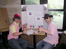 Two Students with Poster