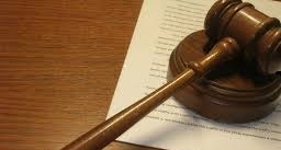 A gavel on legal paper